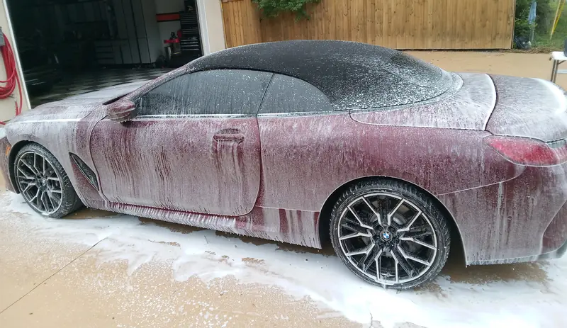 A BMW 8 Series convertible during the wash