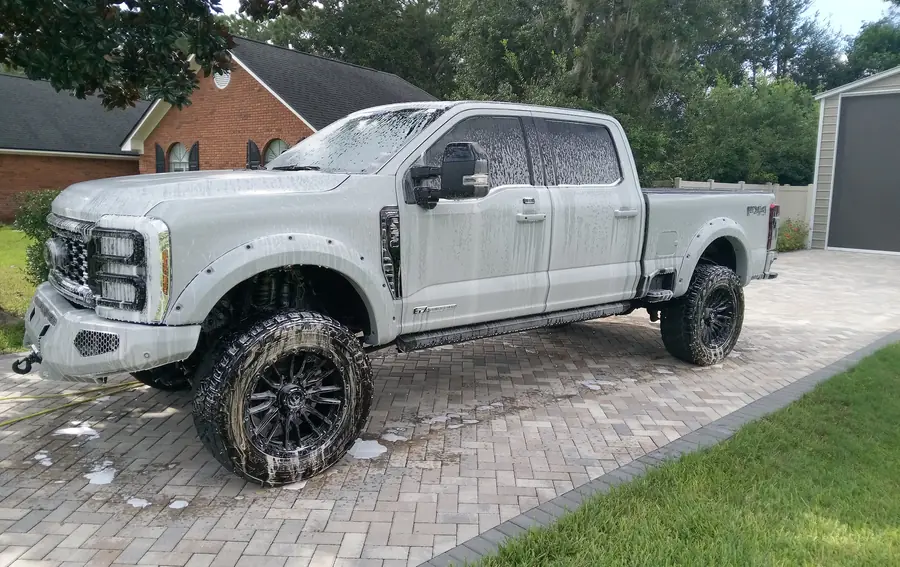 A lifted Ford F-250 Super Duty during the wash